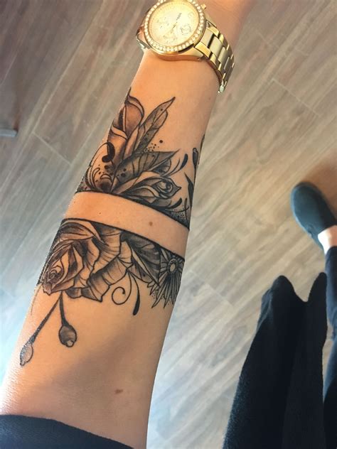 flower band tattoo|flower arm tattoos for females.